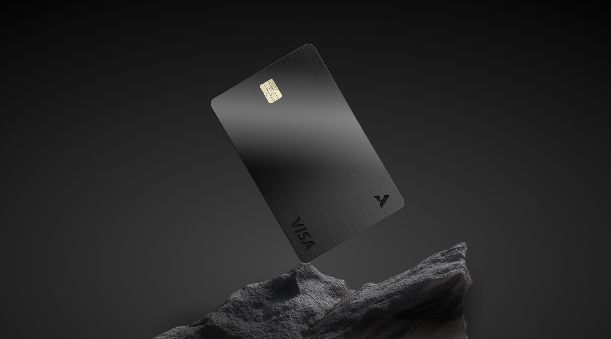 The black metal card, standing on stone.