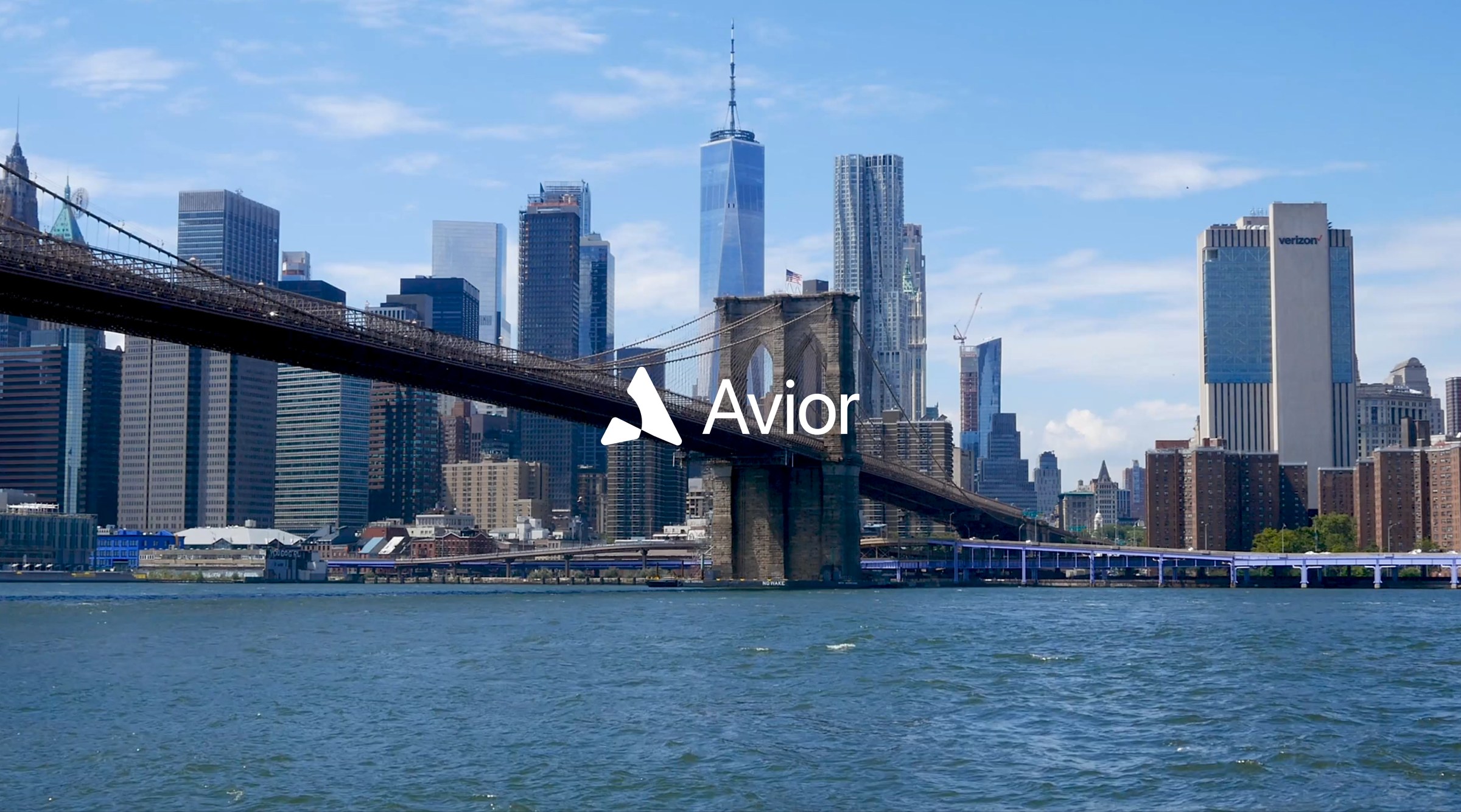 A city skyline across the water, with the Avior wordmark over it.